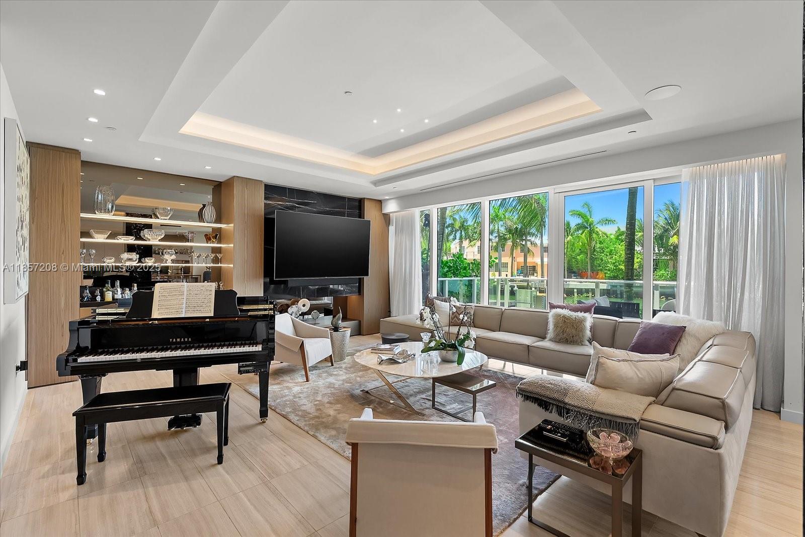 Residence 126 at The Ritz-Carlton Residences, Miami Beach is a rare two-level waterfront home offering 3 bedrooms + den, 3 baths, and 4,109 total SF. Designed by Rogers Zwickel, interiors feature 10’2” ceilings, floor-to-ceiling impact glass, a great room with custom millwork, and a chef’s kitchen with Gaggenau appliances, black marble island, and European cabinetry. Enjoy a private plunge pool, two-level waterfront deck, and serene waterway views. Resort-style amenities include a marina, rooftop pool, spa, restaurant, 24-hour concierge, and valet.