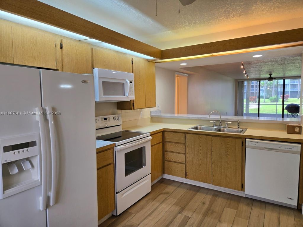 Photo of 2701 N Village Blvd #102, West Palm Beach, FL 33409 (MLS # A11907681)