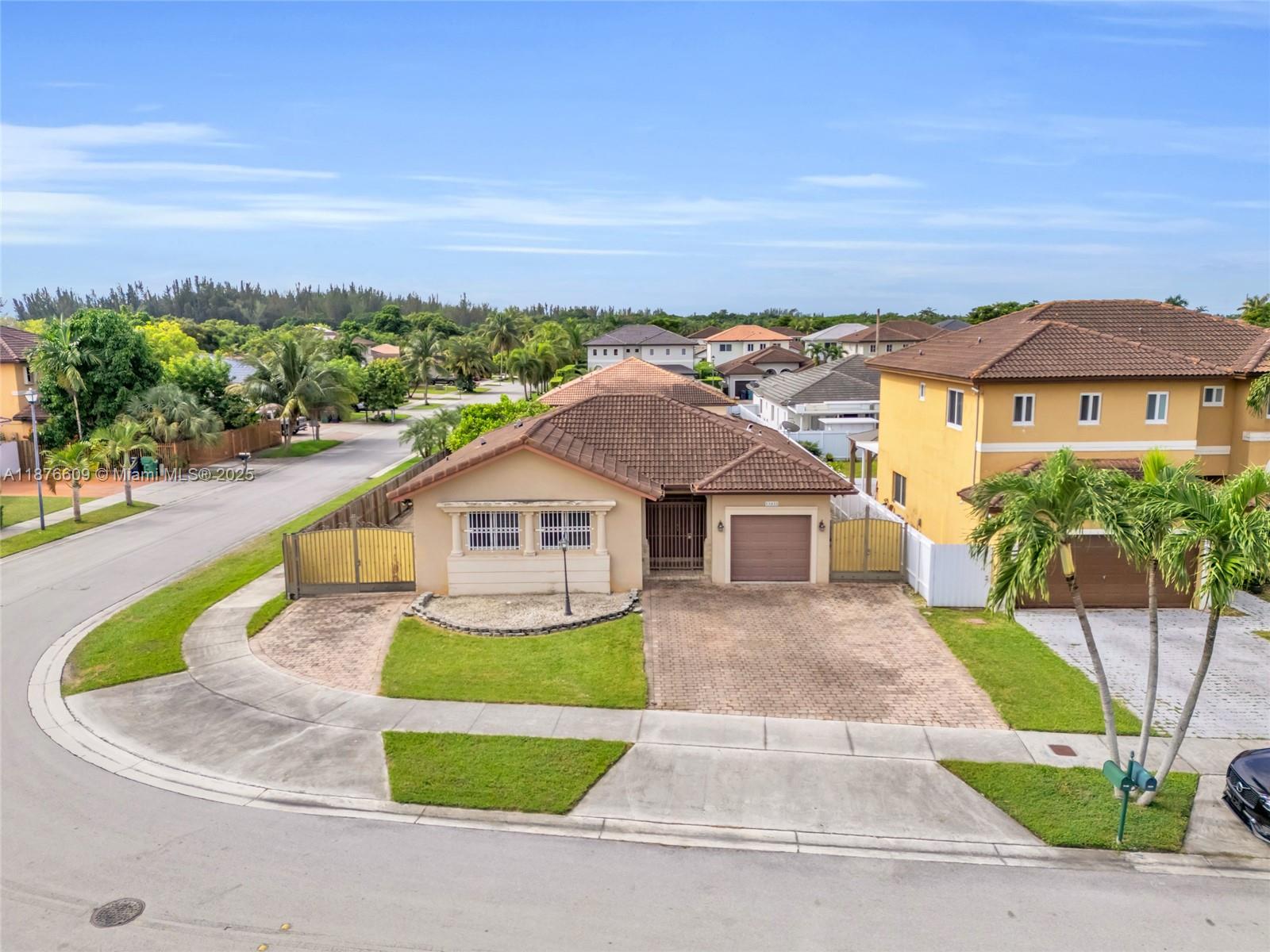 Charming single-story home set on a desirable corner lot in the Homestead area. This home is perfect for easy entertaining and comfortable living. Large windows fill the home with natural light. A generous side entry provides ample room for parking a boat or RV, a rare feature in this location. The absence of a homeowner association offers added freedom and flexibility for future owners. Whether hosting gatherings or enjoying everyday moments, the home’s layout is designed to meet a variety of needs. Located near shopping centers such as Publix and Walmart, with convenient access to the Florida Turnpike and only a short drive from Homestead Air Force Base, this home combines comfort with a prime location.