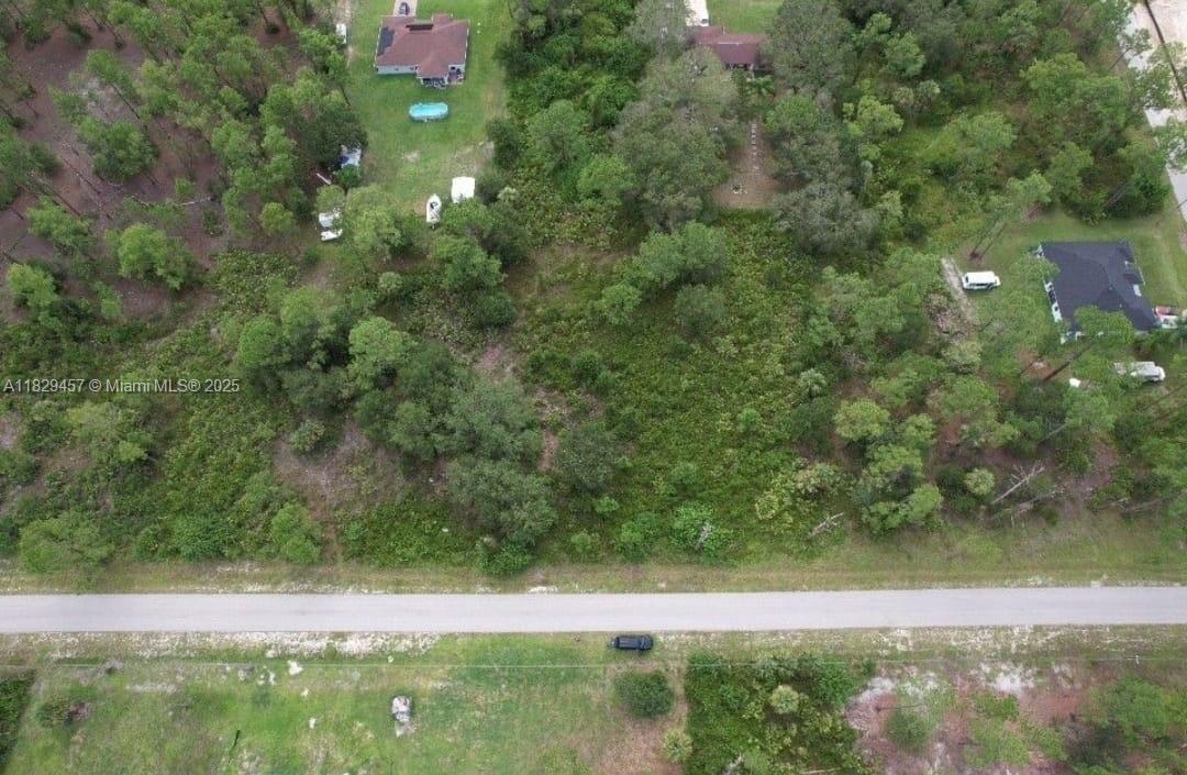 JUST REDUCED!! 1/2 acre lot of land build the house of your dreams in lehigh acres just 30 minutes from Fort Myers Beach. Rapidly growing city, prices are going up fast. Up to 38 feet high construction allowed