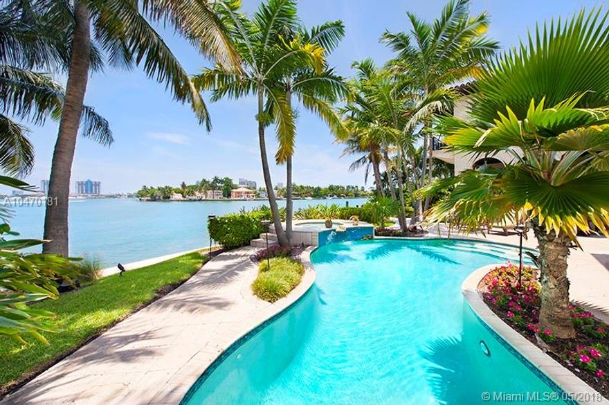 Spectacular Mediterranean-style waterfront home located on NE tip of Dilido Island - wide bay views on Venetians. Architecture by famed Ramon Pacheco. Six bedrooms, Six and half bath, spacious living and dining rooms, and covered exterior dining with summer kitchen. This home boasts character with curved archways, marble floors and intricate details in its design. Radius windows and glass doors showcase panoramic bay views throughout the home. Private dock with over 100 feet waterfront, 2-car garage.