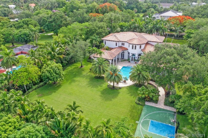 Great opportunity to own a coveted gated & custom 7 bedrooms/8.5 bathrooms estate w/ 3-car garage, on a deep oversized lot w/ custom design landscaping, located in prestigious N. Pinecrest. Some of the amazing features of this property are: Resort style amenities, including oversized pool and spa, 2 large, covered terraces with S/S built-in grill & bar, multi-sport court, gourmet kitchen w/Euro wood cabinets & Thermador appliances, family room w/bar & fireplace. Maids quarter, gym/media room, library/office, w/ 3 separate built-in desks, insulated & pre wired closet to be converted into a wine cellar. 2 story foyer w/ panoramic pool & garden views and much more. Walking distance from Gulliver Prep.