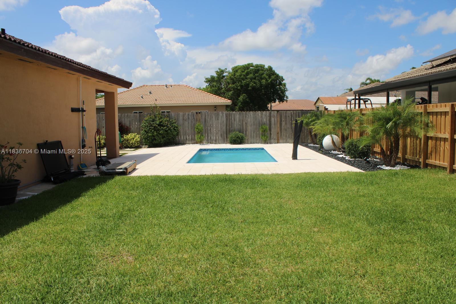 Welcome to spacious 4-bedroom, 2-bathroom home located in the heart of Homestead. This move-in-ready property features modern upgrades, spacious interior, and your very privete pool. Greeted by brand-new ceramic tile flooring througout, offering a sleek, modern feel, newly renovated bathroom with contemporary fixture and finishes, adding comfort and style. Open-concept living and dining area with potential for 5th bedroom or office. Step outside into your private backyard oasis, complete with a sparkling heated pool, perfect for relaxing or hosting weekend BBQ. Minutes from the Florida Turnpike, shooping centers, and park. Exit 2 of Florida Turnpike. NO HOA