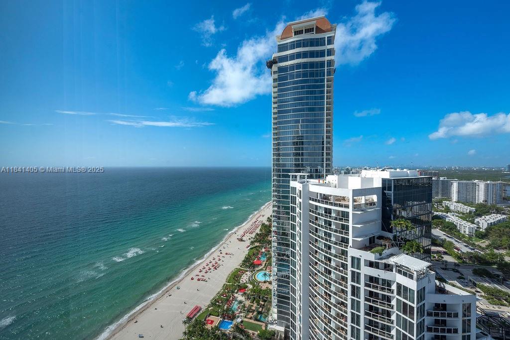 Bright and spacious 3 bedroom + den, 3.5 bath residence with sweeping views of the ocean, city, and Intracoastal. Located on a high floor and offered unfurnished, this unit features a private elevator foyer, floor-to-ceiling windows, high ceilings, and a large wraparound terrace ideal for indoor-outdoor living.The European-style kitchen includes granite countertops, stainless-steel appliances, and sleek cabinetry. The den offers flexibility as a home office, media room, or guest space. Residents enjoy access to 1,000 feet of private beachfront, multiple pools, tennis courts, full-service spa and fitness center, business center, beachfront restaurant with room service, concierge, 24-hour valet, and a private dog park. Ownership also includes access to amenities at the Trump Int. Hotel.