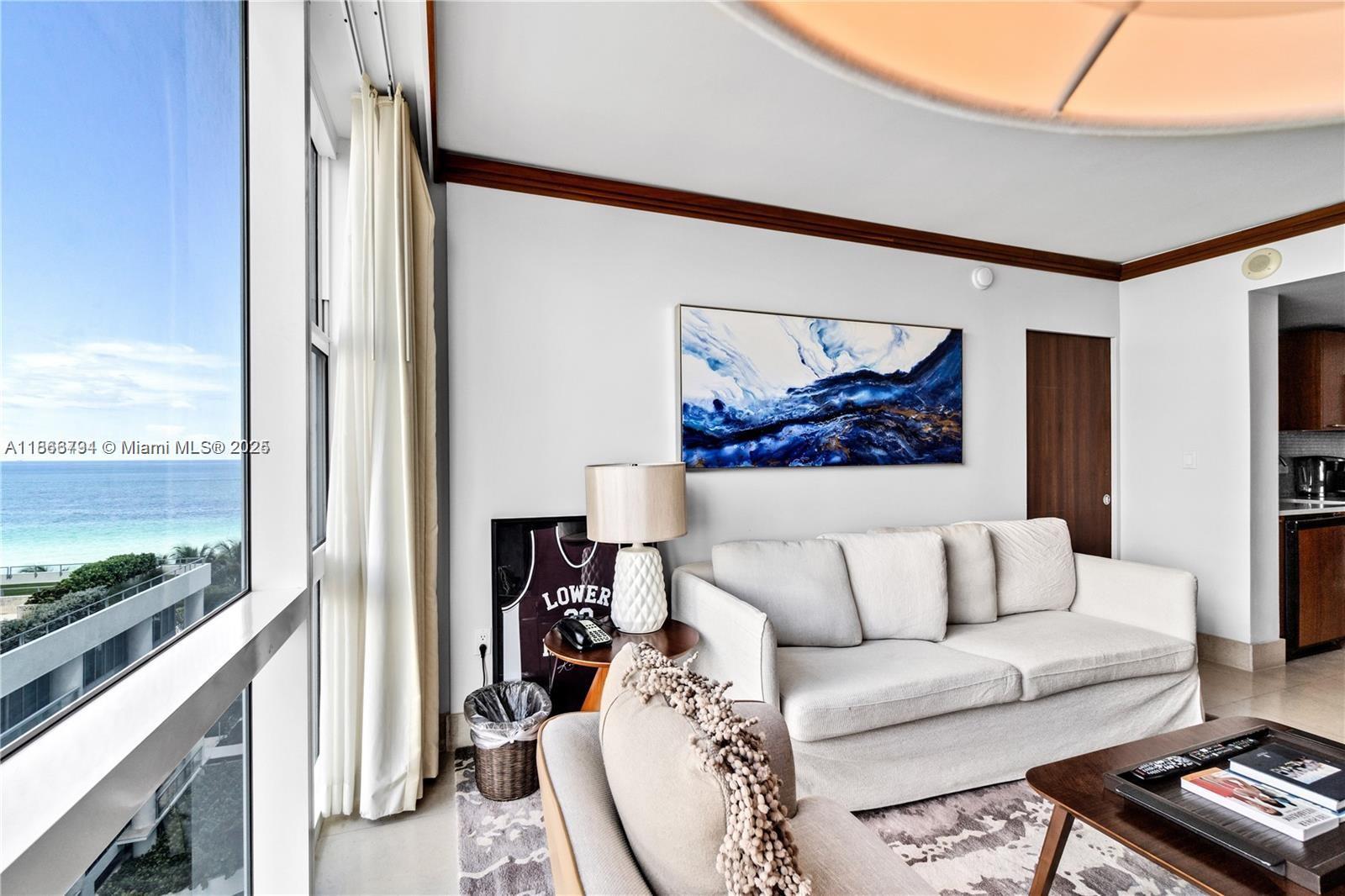 Experience luxury living at the prestigious Carillon Miami Beach. This fully renovated 2-bedroom, 2-bath residence offers 887 sq ft of elegant living space with breathtaking views. Enjoy marble floors, high-impact windows, and a modern open layout. Owners benefit from world-class resort amenities including spa, fitness center, four pools, beach service, restaurants, 24/7 security, and valet.