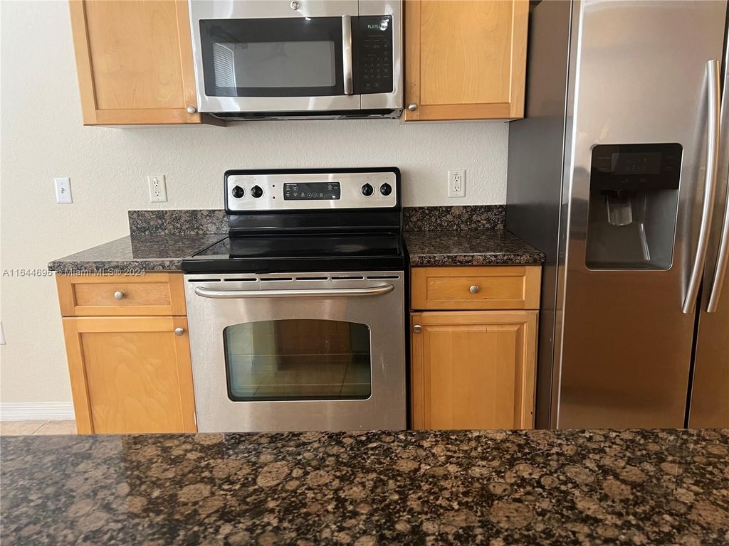 Photo of 11010 Legacy Dr #102, Palm Beach Gardens, FL 33410 (MLS # A11644696)