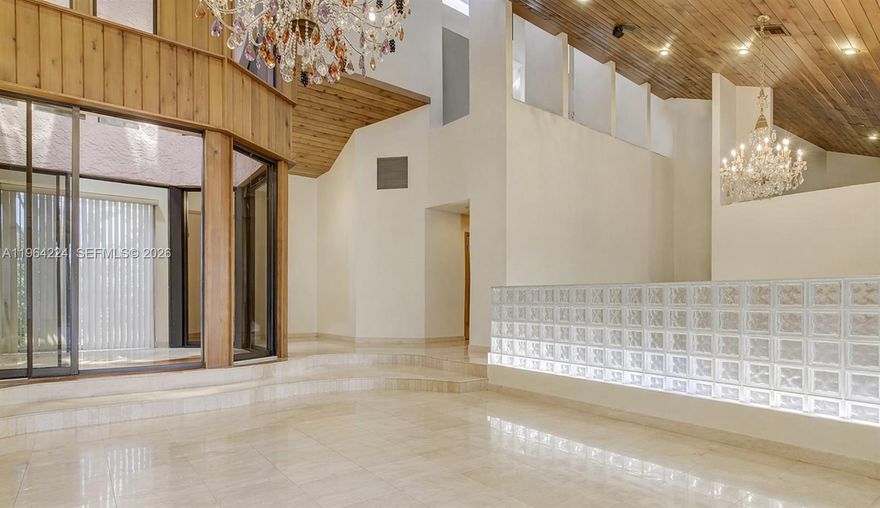 TRANSFORM THIS 22’ CEILINGS 5000 SF/AC+/- 5BD/4BA+DEN+2ND STORY LOFT, OPEN FLOOR PLAN BACKING ONTO EXCLUSIVE AUBERGE RESORT SHELL BAY GOLF & COUNTRY CLUB. OVERSIZED 1200 SF PRIMARY SUITE W/16’ CEILINGS. EXPANSIVE PRIMARY BATH SF. SOARING GLASS THROUGHOUT + 5 SKYLIGHTS GIVE AMPLE NATURAL LIGHT. TRAVERTINE THROUGHOUT. ATRIUM IN ENTRY FOYER OPEN TO THE SKY. SURROUND SOUND IN & OUT. ZEBRANO WOOD KITCHEN W/MIELE APPLIANCES. WHOLE HOUSE GENERATOR. COVERED OUTDOOR ENTERTAINING W/ LARGE 24’X32’ MOSAIC TILED HEATED SALTWATER POOL. OUTDOOR BBQ COOKING AREA. 9 FT ELEVATION. FRONT ENTRY ACTIVE KOI FISH POND. 10 YEAR OLD ROOF & MAJORITY IMPACT GLASS. TWO CAR GARAGE W/WORK AREA.