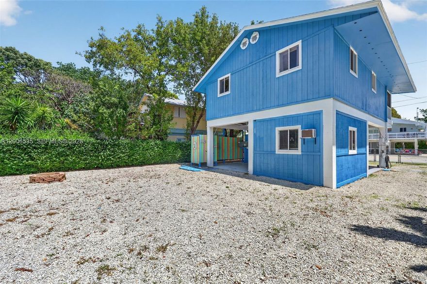 Welcome to beautiful Key Largo. This home in the desirable Bay Haven community offers the perfect blend of comfort, flexibility, and island living. Ideally situated near local dining, shopping, State Parks, you’ll enjoy easy access to boating, fishing, diving, and all the Keys have to offer. The home features 3 bedrooms and 2 bathrooms. One bedroom and bathroom is on the ground level, ideal for guests, extended family, or added privacy. Upstairs, you’ll find two additional bedrooms and full bathroom, along with the main living space and welcoming balcony—perfect for enjoying your morning coffee or relaxing in the evening breeze. The property includes generous parking for vehicles, boats, trailers, and other recreational equipment. Outdoor spaces include a spacious backyard with outdoor shower and offering plenty of room for entertaining, storage, or enjoying the tropical surroundings. Residents of Bay Haven enjoy access to a private, gated homeowners park featuring a boat ramp and sandy beach. Annual dues for 2026 is  $550 and include one parking permit and key fob entry access. This property currently operates under a special vacation rental license allowing short-term rentals of fewer than 28 days marketed through Airbnb. Buyers are encouraged to independently verify all zoning, licensing, and permitted uses with Monroe County. Well cared for this Key Largo retreat is ready to enjoy as a full-time residence, vacation getaway, or investment opportunity.