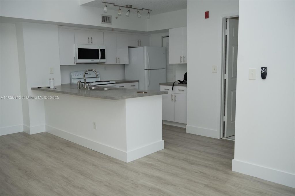 Photo of 2600 S University Dr #311, Davie, FL 33328 (MLS # A11835862)