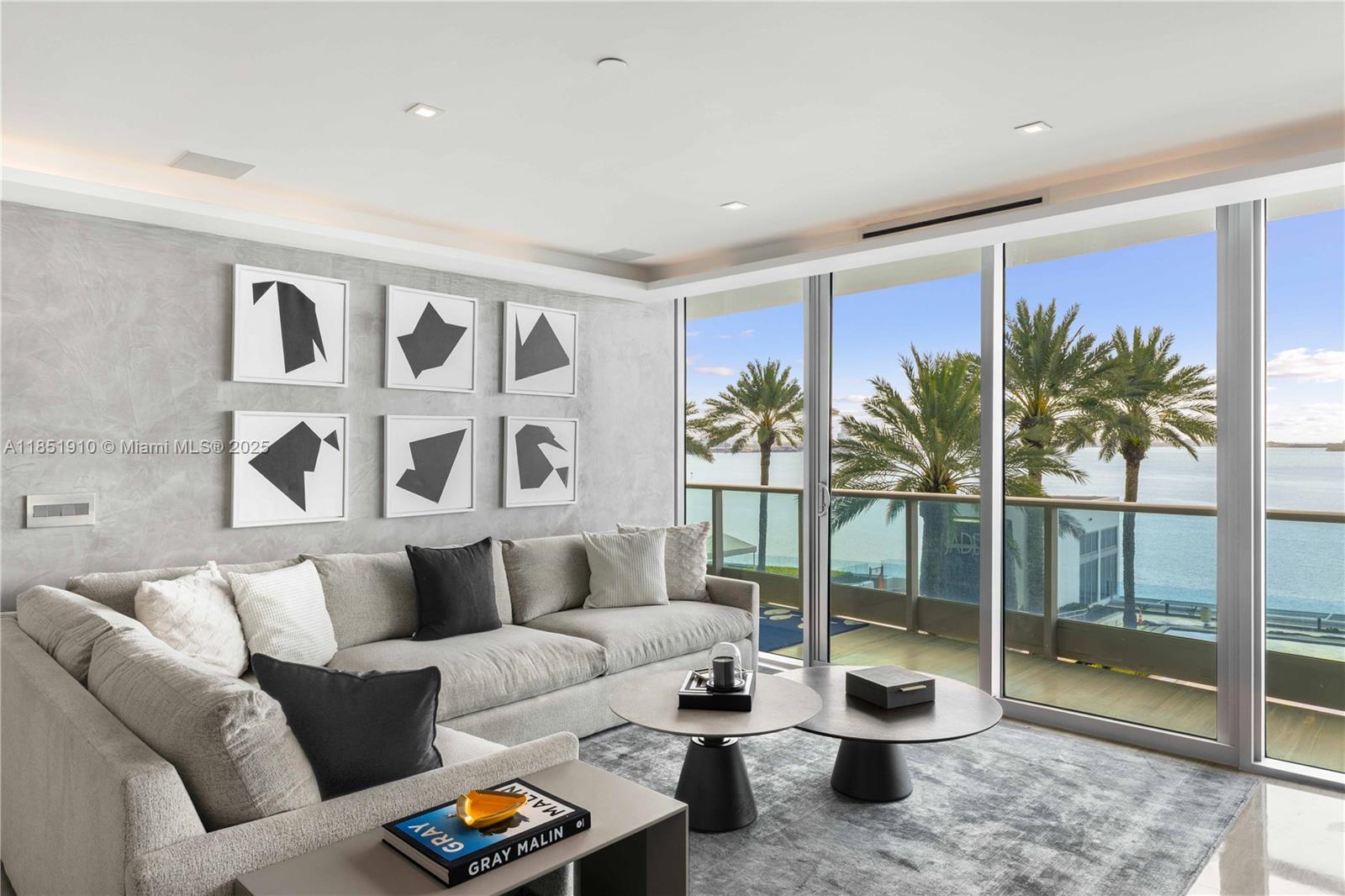 Completely reimagined and move-in ready, this 2-bed, 2.5-bath furnished residence at the iconic Jade Brickell offers refined finishes and direct bay views. A private elevator opens to a light-filled living area with floor-to-ceiling impact windows and a spacious balcony. The custom MiaCucina kitchen features quartz counters and Miele, Wolf, and Sub-Zero appliances. Additional upgrades include Legrand switches, Hunter Douglas shades, Ital doors, and Anima Domus closets. No expense was spared in this custom renovation.
The primary suite offers dual walk-ins and a spa-like bath with soaking tub, glass shower, and Blu Bathworks fixtures.
Enjoy full-service amenities including a bayfront resort-style pool, spa, fitness center, racquetball court, business center, children’s room, & more.