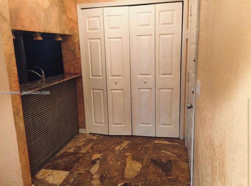 BEAUTIFULLY REMODELED one bedroom/one bath condo in Gated Community. Upgraded kitchen, Onyx countertops, designer lighting, S/S Appliances. Upgraded bathroom with designer tiles. New wood look floor tile. New A/C system. Full sized washer and dryer in unit. Balcony with storage room overlooking golf course. Garage available. New roof- No special assessments!