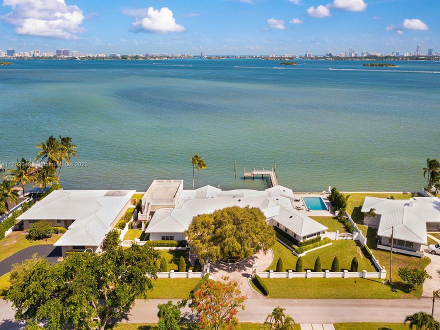 Welcome to the most spectacular and best priced bayfront property in Miami! This is a double lot in beautiful Miami Shores with 28,047-sf of land, 187-feet of wide bayfront, and an oversized pier dock! The perfect development opportunity for investors/developers to build 2 new bayfront homes (each with 14,000-SF land and 93-FT of on the water) or 1 custom mega-mansion with 187-ft on the bay! The current home on the property is a single-story home with 5 beds, 4.5 baths, large living/Florida room, high ceilings, a rooftop deck, with great potential to update and modernize. Perfectly manicured property with circular driveway, 2-car garage, and a large pool.