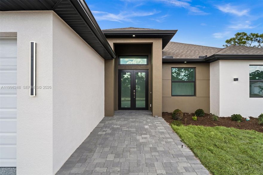 READY TO MOVE IN!!! Spacious open floor plan with 3 bedrooms + Den, 2-full bathrooms and 2 cars garage, home spans 2,005 sq ft. Hurricane impact windows and doors. Home features a state-of-the-art kitchen equipped with stainless steel appliances, high-quality cabinetry, quartz countertops and backsplash, and a waterfall edge island. The master suite offers comfort with the spacious master bathroom providing an elegant retreat with a double sink vanity and a frameless glass shower. Imported oversize porcelain flooring, dual walking closets and lofty ceilings flow throughout, elevating the modern feel of the property. Blending modern design with high-end finishes. Outdoors a beautifully landscaped garden with a covered lanai. The driveway goes all the way down to the double garage entry door. This street offers peace and quiet along with added safety for the family. This house is a great choice for anyone looking for a harmonious blend of modern design and comfortable living. This property is just what you're looking for. Don't miss the opportunity to own this beautiful property. Make this your dream home now. Ready to move in !!! Enjoy an outstanding home that perfectly combines comfort and luxury!!!!