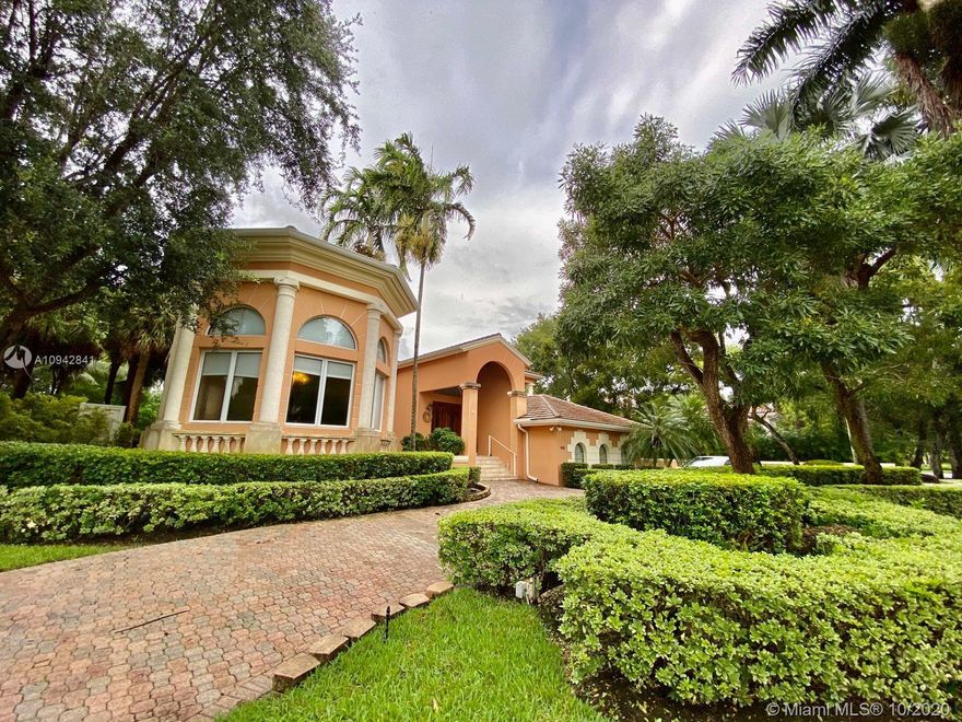 Unique and Exquisite corner property in Prestigious Cocoplum - home features 6 bedrooms with en-suite baths and wood finished closets. Large formal living room with volume ceilings, formal dining room overlooking the gardens, spacious family room with mahogany built-ins and views of the water and swimming pool. Second floor master suite and sitting area have lovely water views and a private terrace. 157ft water frontage with Private dock (Access to the bay), full house generator, the home-office, gym, sauna, movie theater/music studio complete this special offering. 18,843 sqft corner lot. New roof was installed in 2019.