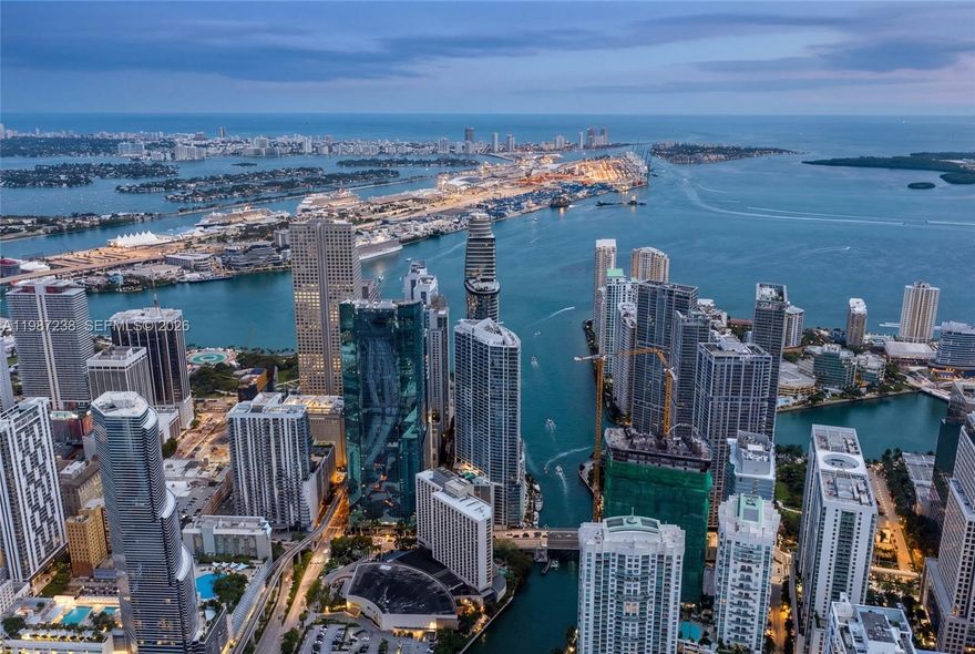 Perched on the 50th floor of a sleek modern tower: EPIC, this newly remodeled European-inspired condo marries cutting-edge design with timeless elegance and premier Italian finishes. Floor-to-ceiling windows frame sweeping water and city panoramas, flooding the open-plan living spaces with light. The chef’s kitchen, by MODULNOVA, features New integrated handle-less cabinetry, NEW high-end Miele appliances, and new stone countertops with a dramatic island. New Spa-caliber bathrooms boast designer fixtures, an oversized Jacuzzi, a new walk-in shower, new radiant surfaces and microcement walls. Oversized white porcelain tile flows throughout the residence, complemented by new custom closets, a new built-in glass wardrobe, recessed lighting, Italian plaster in the living room, and a second bedroom outfitted with new bespoke DIOTTI cabinetry. Thoughtful finishes and a seamless flow from entertaining areas to private quarters create a turnkey luxury residence. Residents enjoy concierge-level service, premier building amenities, and immediate access to the city’s finest dining and shopping.