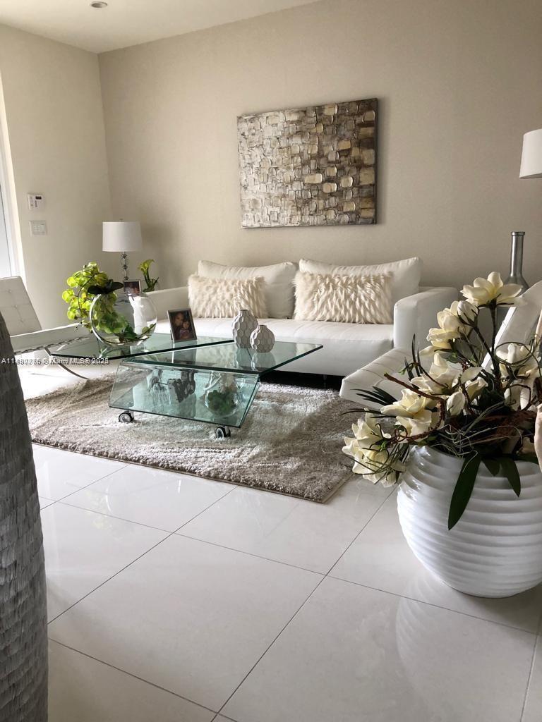Step into elegance and modern comfort in this beautifully appointed townhouse located in the prestigious community of Landmark Doral. This spacious residence offers 4 bedrooms and 3.5 bathrooms, designed with an open-concept layout that perfectly blends style and functionality.
Enjoy high-impact windows and doors, sleek porcelain tile flooring throughout, a striking glass staircase railing, and a contemporary kitchen featuring quartz countertops and premium stainless-steel appliances. Upstairs, you’ll find a convenient in-unit laundry area.
Residents of Landmark Doral enjoy access to an impressive array of resort-style amenities, including multiple swimming pools, a jacuzzi, a state-of-the-art fitness center, tennis courts, sauna, children’s water park, and more