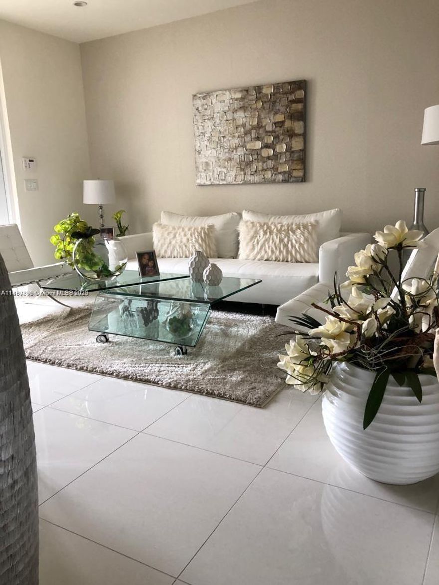 Step into elegance and modern comfort in this beautifully appointed townhouse located in the prestigious community of Landmark Doral. This spacious residence offers 4 bedrooms and 3.5 bathrooms, designed with an open-concept layout that perfectly blends style and functionality.

Enjoy high-impact windows and doors, sleek porcelain tile flooring throughout, a striking glass staircase railing, and a contemporary kitchen featuring quartz countertops and premium stainless-steel appliances. Upstairs, you’ll find a convenient in-unit laundry area.

Residents of Landmark Doral enjoy access to an impressive array of resort-style amenities, including multiple swimming pools, a jacuzzi, a state-of-the-art fitness center, tennis courts, sauna, children’s water park, and more