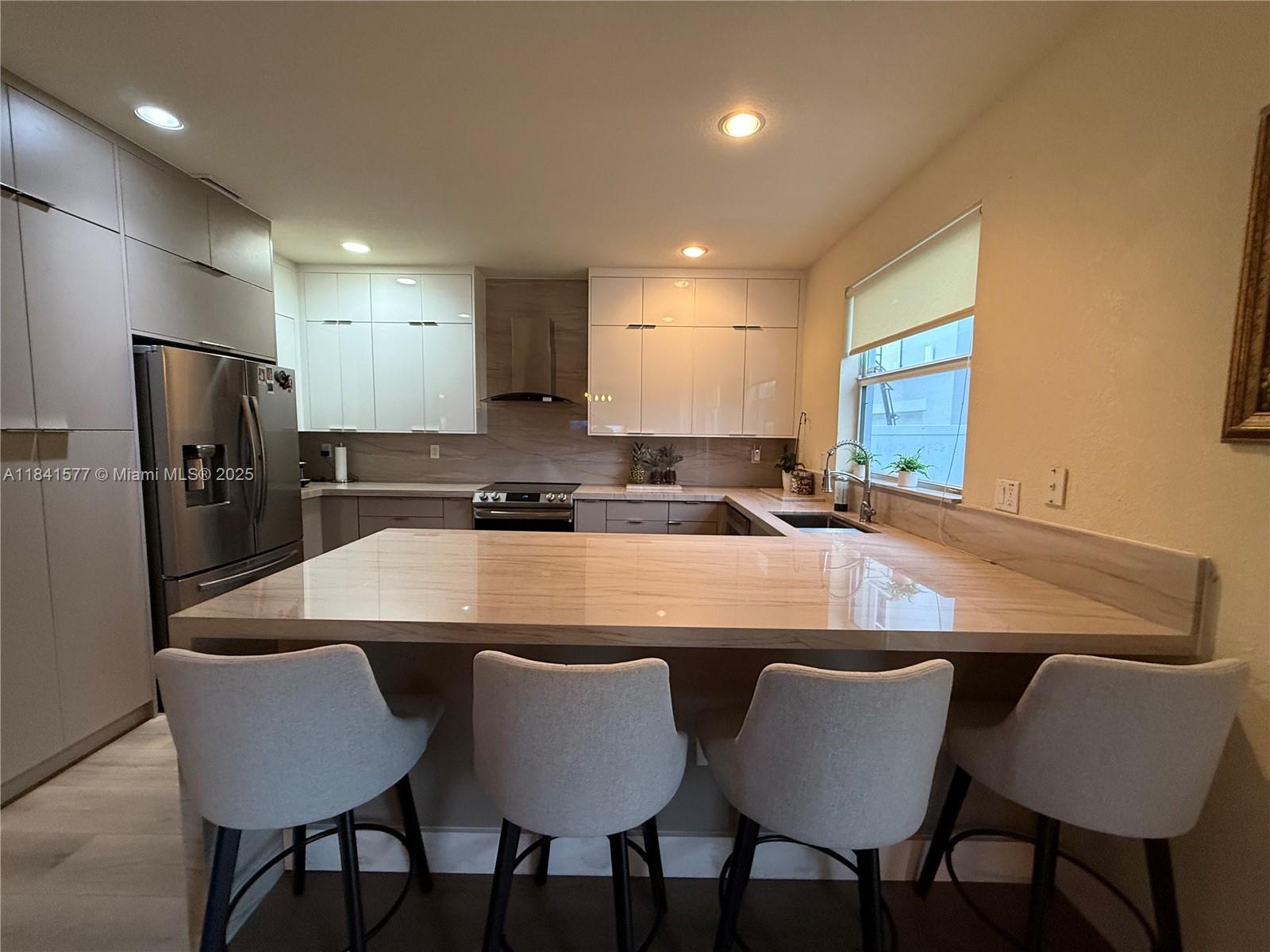 This stunning two-story home in Miami seamlessly blends modern elegance with Cozy open spaces . The home boasts expansive open-concept living areas hight ceiling with natural light and create a bright, airy ambiance. The first floor offers a spacious living room, a formal dining area, and a sleek gourmet kitchen with stainless steel appliances and quartz countertops. a private backyard with a lot of potential for a new pool or a perfect backyard or tropical landscaping and space for outdoor dining, second floor you'll find generously sized 4 bedrooms, including a master suite complete with a walk-in closet and en-suite bathroom a perfect gem in the great Kendall square community. 4 parking spaces, 2 inside garage and 2 on driveway.