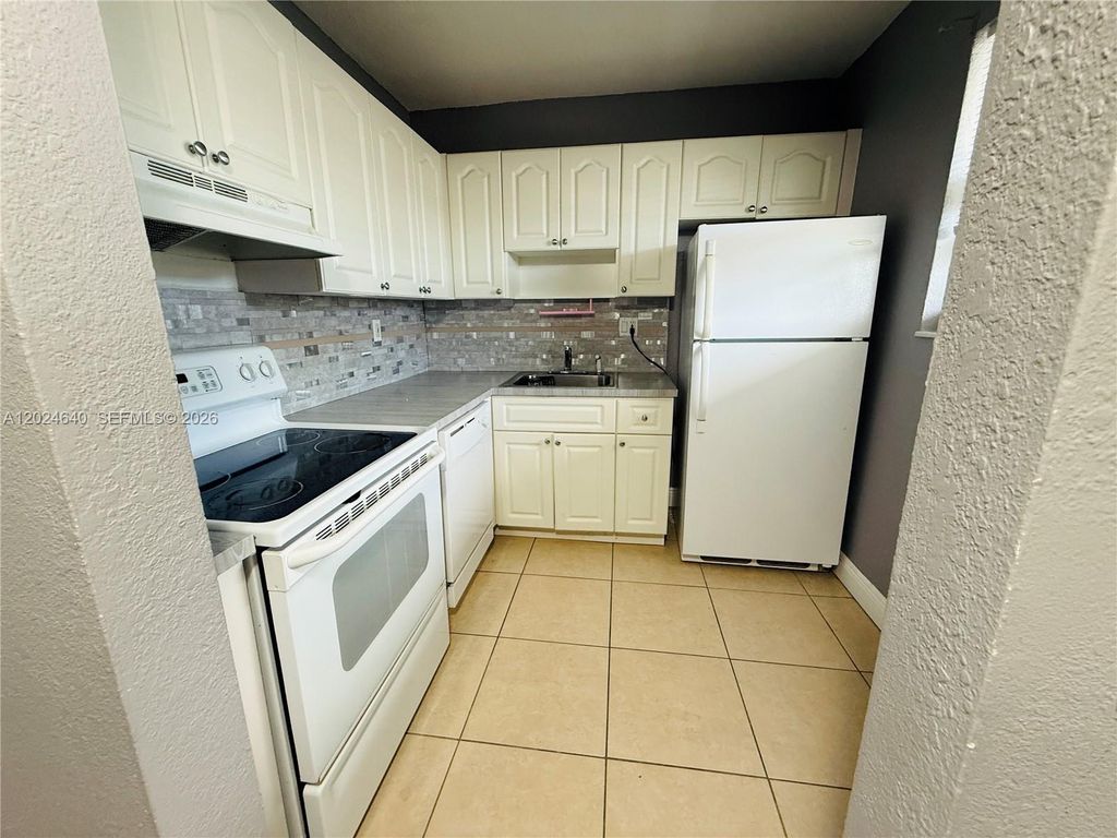 Photo of 2040 NW 89th Ave #204, Pembroke Pines, FL 33028 (MLS # A12024640)