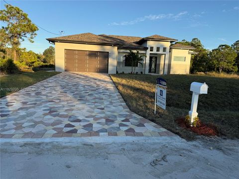 Photo of 843 S Burns Ave S, Lehigh Acres, FL 33974 (MLS # A11923705)