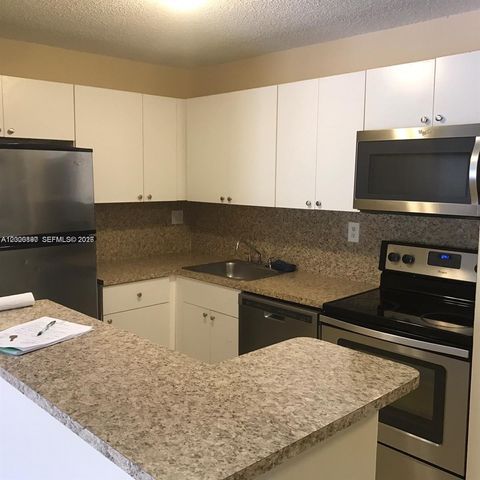 Photo of 7200 NW 179th St #302, Hialeah, FL 33015 (MLS # A12000890)