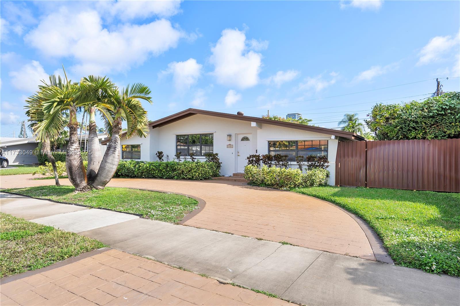 Located in the heart of Aventura, gated community. This cosy home features 3 bedrooms and 2 bathrooms, making it move-in ready. The kitchen boasts granite countertops, wood cabinets, and stainless steel appliances. Enjoy the formal dining room with 2 wine coolers and a spacious family room. Tile floors are throughout the home. The large backyard offers room for a pool. Additional highlights include a stamped concrete driveway and a large storage shed. Located steps from top-rated schools, places of worship, parks with pickleball and a tot lot, and close to beaches, Aventura Mall, Brightline station, and major highways (I 95), Fort Lauderdale and Miami Airport, Top rate A schools . 24-hour guard-gated community.
