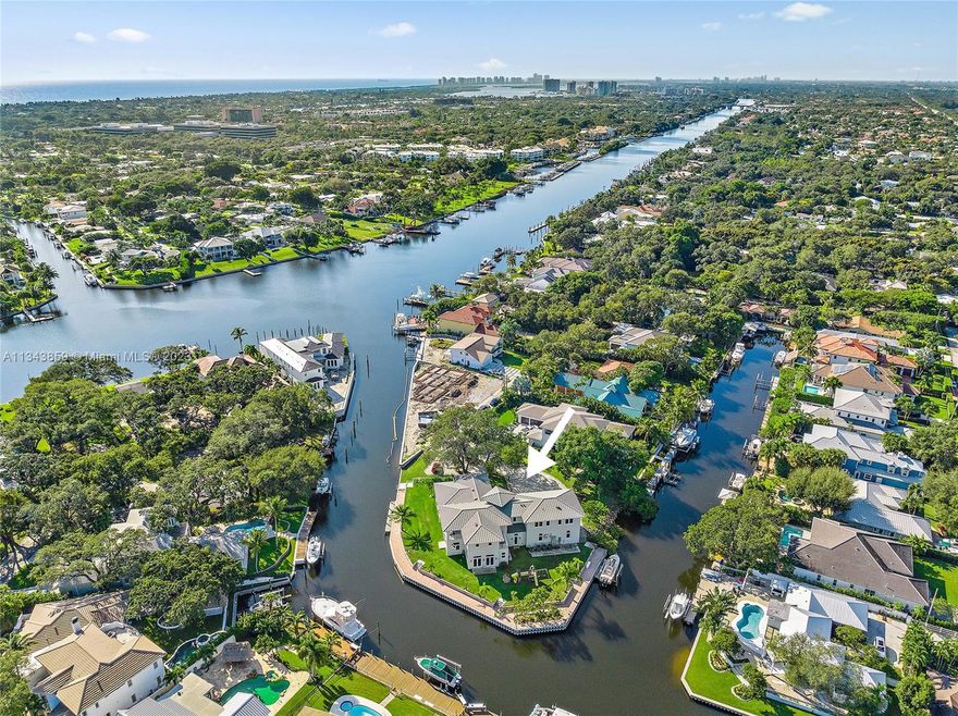 Located directly in the middle of North County this one-of-a-kind acre plus waterfront Point lot has over 400' of frontage, two docks & an 8,000lb boat lift. Designed with large spaces this home offers a ground floor mother-in-law suite, a 27'x18' game room with wet bar, & an expansive Chef's kitchen with top-of-the-line appliances, Silestone Quartz countertops, large center island & an eat-in breakfast bar. Adjoining the kitchen is a 30'x26' great room with an indoor/outdoor fireplace, Nano doors leading to the expansive covered loggia & views of the water. The spacious master bedroom has wood floors, large walk-in closets & his & her baths. The structure is CBS on both stories & has a poured concrete staircase & second floor slab. There's room for a pool off the kitchen great room.