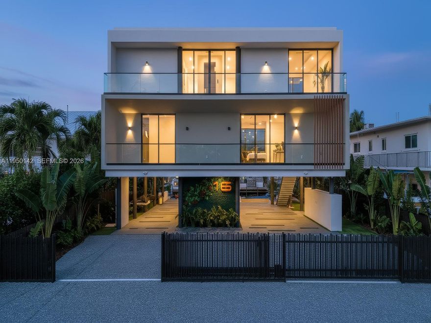 Waterfront luxury in the heart of Key Largo, Florida. This newly constructed home combines modern opulence and an unmatched location. Tastefully designed for island living, the property boasts an array of high-end finishes and a thoughtfully curated layout. The main level of the home features 4 bedrooms and 4 and a half bathrooms along with a sprawling covered patio and plentiful entertainment space. Upstairs, you’ll find the primary suite, kitchen, great room, and additional porch space to embrace true indoor-outdoor Keys living. Relax and entertain in style with a private infinity-edge lap pool and luxurious champagne spa, perfect for unwinding after a day on the water. Your boats are ready to be docked at the newly installed 70-foot concrete seawall and dock, making this an ideal retreat for boating enthusiasts. Additional highlights include Miele kitchen appliances, nine-foot impact glass windows and doors, a solar panel system, full audio throughout all rooms and outdoor spaces, a CCTV camera security system, an outdoor summer kitchen, a putting green and much more.