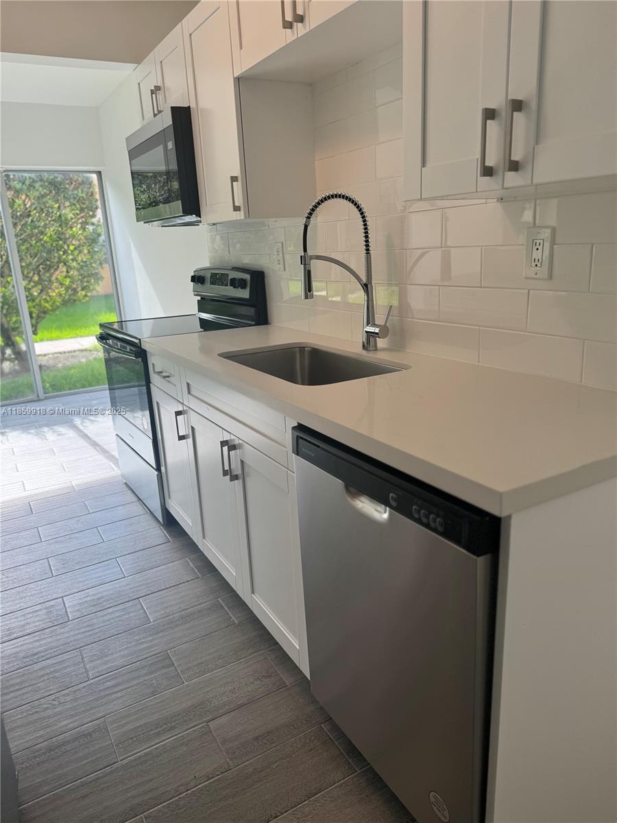 Welcome to this beautifully renovated 1-bedroom, 1-bath unit featuring brand-new appliances and a fresh, modern look throughout. Situated on the ground floor, this home offers convenience and style in one perfect package.
Enjoy the unbeatable location—right in front of a vibrant plaza with restaurants, a gym, Walmart, and more. Just minutes from FIU, Miami International Airport, major highways, and shopping centers, making it ideal for both living and investment. Assigned Parking right in the front of it. New AC unit.