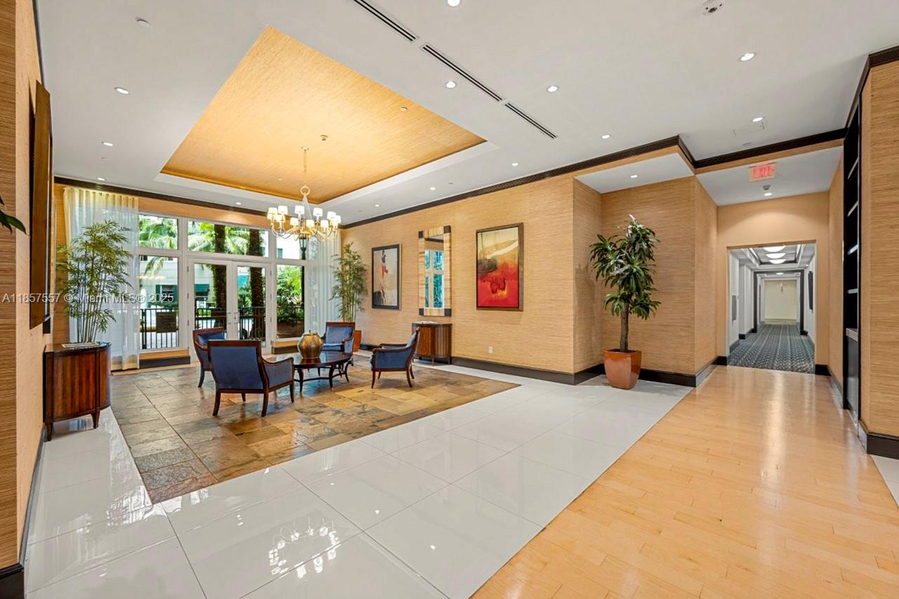Stunning 2BR/2BA condo in pristine, move-in condition! Bright open layout with wood floors, granite counters, S/S appliances, and impact glass. Luxury touches include European cabinetry, marble shower, soaking tub, and smart key FOB entry. Enjoy resort-style living with elegant lobby, tropical pool & Jacuzzi, fitness center, dry sauna, 24-hr manned front desk, and advanced security systems. Internet, cable TV, and water included—your perfect home awaits!