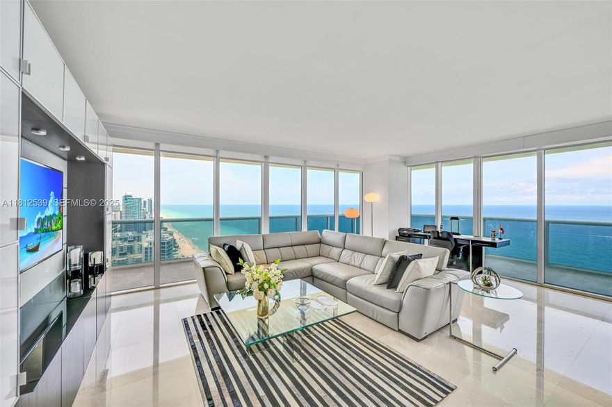 Spectacular NE corner unit on the 38th floor with breathtaking direct ocean, Intracoastal & skyline views. This 3 bed / 3 bath residence offers 2,065 sq. ft. of interior space plus a 565 sq. ft. wraparound balcony. Features include marble floors throughout, California closets, and a European-style kitchen with granite countertops and KitchenAid appliances. The primary suite includes a Jacuzzi tub and separate shower. Enjoy 5-star resort-style amenities: 2-story lobby, concierge, 24-hour security & valet, 5 heated pools, and a 50,000 sq. ft. oceanfront spa & fitness center. Includes 1 assigned parking space + free valet. 30-day min rentals, 12x/year. Easy to show.