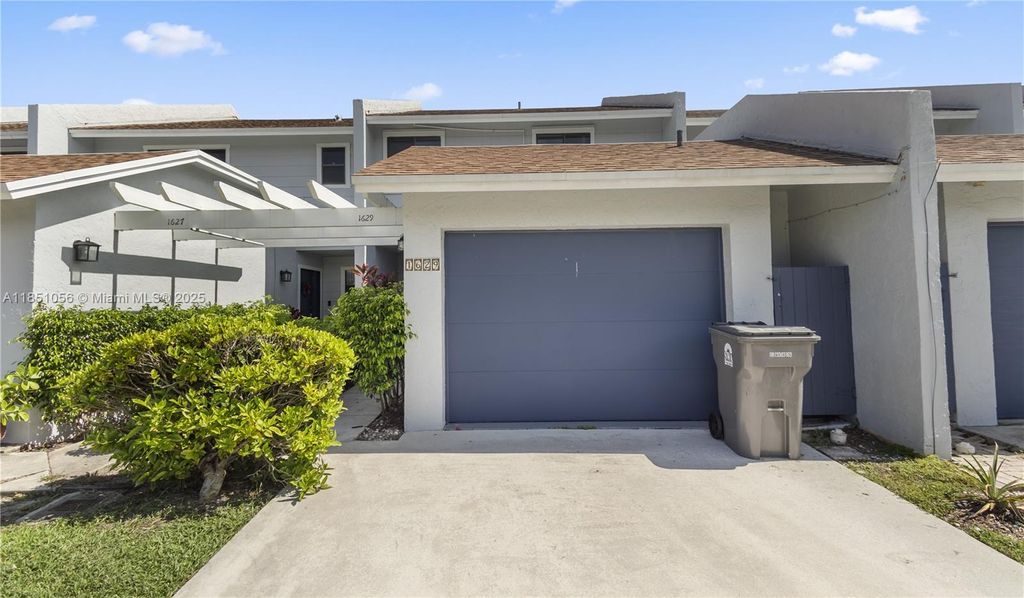 Photo of 1629 Woodbridge Lakes Cir, West Palm Beach, FL 33406 (MLS # A11851056)