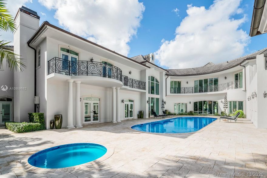 Sophisticated French Transitional masterpiece on a corner lot.This unique sanctuary features one of a kind style & leaves no detail spared.Upon entering 12ft ceilings & custom millwork are breathtaking.Principal suite is adorned with grand entrance,fireplace & extensive master spa bath.Home has 2 master suites & large balconies from every bedroom that flow right thru to the exquisite outdoor spaces.Solid wood professional chef kitchen fully equipped.Stunning dining w 900 bottle wineroom.Smart home w ample measures of security & fiber optic lighting thru-out.Full house Generator, Elevator, Theatre & Guest House.Ultra luxury living, wood & marble flooring throughout. This rare design was done with the highest quality finishes & professional landscaping. This gated gem is truly one of a kind.