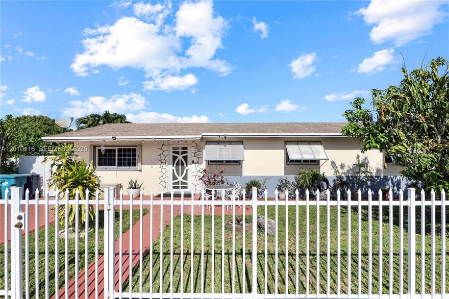 This turnkey home combines structural peace of mind with tropical charm. Recent major upgrades include a newly tented exterior (2023), a six-year-old roof, and impact windows installed in 2021 with a transferable lifetime warranty. The living area shines with elegant crown molding and recessed lighting, complemented by easy-care tile floors, granite countertops, and updated bathrooms. Efficiency and comfort are front and center with added insulation, a seven-year-old water heater, and an AC system featuring a brand-new compressor. Step outside to a spacious covered terrace overlooking a private oasis, complete with an above-ground pool and a lush canopy of mango, banana, and assorted fruit trees. Fully secured with an ADT alarm system and reinforced with additional shutters, this freshly painted residence is move-in ready and built to last.