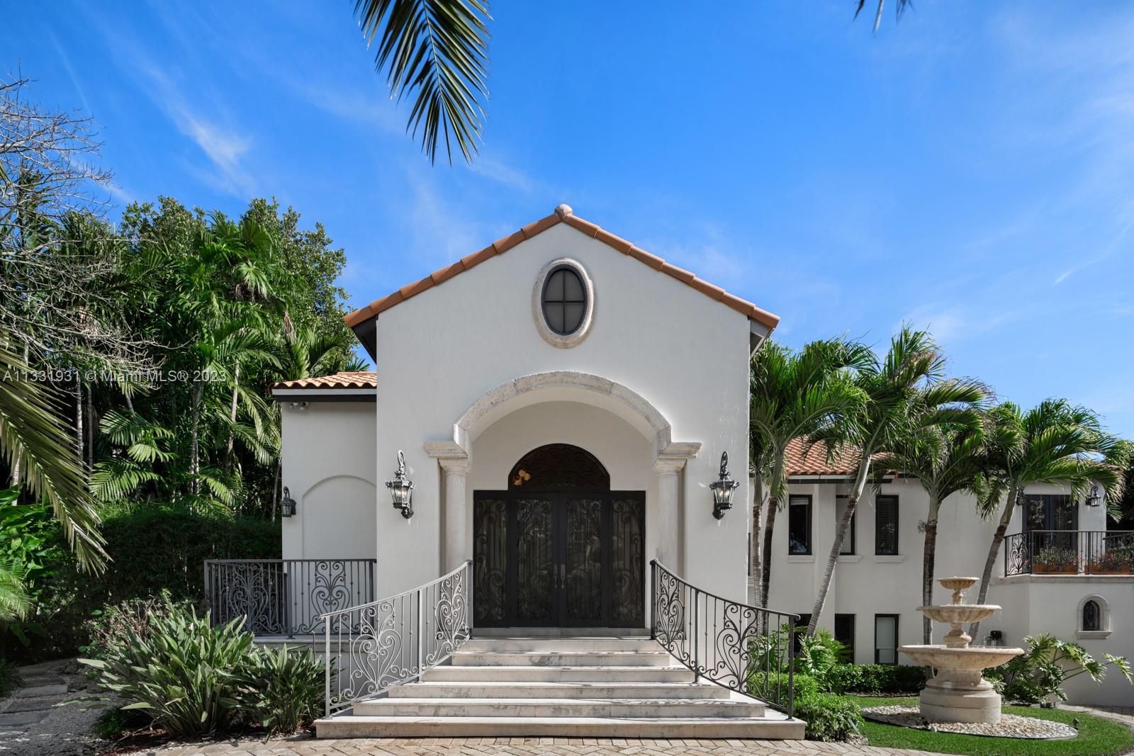A Mediterranean Revival set within the coveted Islands of Cocoplum. Stunning curb appeal and an exquisite entry hint at a luxurious, elevated interior. Tray ceilings, glass walls framing tropical flora and light marble flooring do not disappoint. Built for entertaining, the bright, airy living spaces and state-of-the-art kitchen with Miele appliances and cooking island open up to a resplendent outdoors. Relax and unwind on the covered terrace with a well-equipped summer kitchen, large pool and Cabana bathroom. A sense of privacy is experienced in the third level master suite, with the four additional bedrooms, and ensuite baths located on the 2nd level. Privacy and security, resort-style amenities, and Miami landmarks within a short driving distance make this the perfect setting.