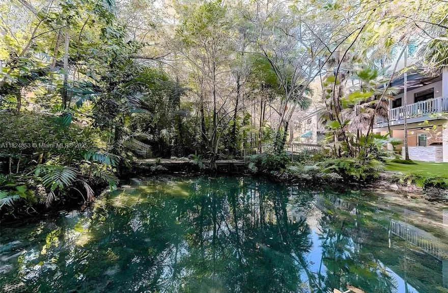 Hurry, this property will not last long! Motivated sellers. The architect truly designed a heterogeneous property. This 5/4 can easily be converted to a 6/4 & a half. Fantastic investment opportunity! This property sits on approximately a one-acre lot nestled in a private gated community surrounded by four other homes. There is NO HOA, yet you get all the security benefits. This gorgeous oasis boasts a natural koi pond with two waterfalls, a stream, and a small bridge connecting to the pond. The home is great for entertaining and/or family. From a spacious kitchen, gym, and a huge wine cellar. There is nothing this house lacks other than some TLC from a new, lucky owner. One look at this house and you'll fall in love!