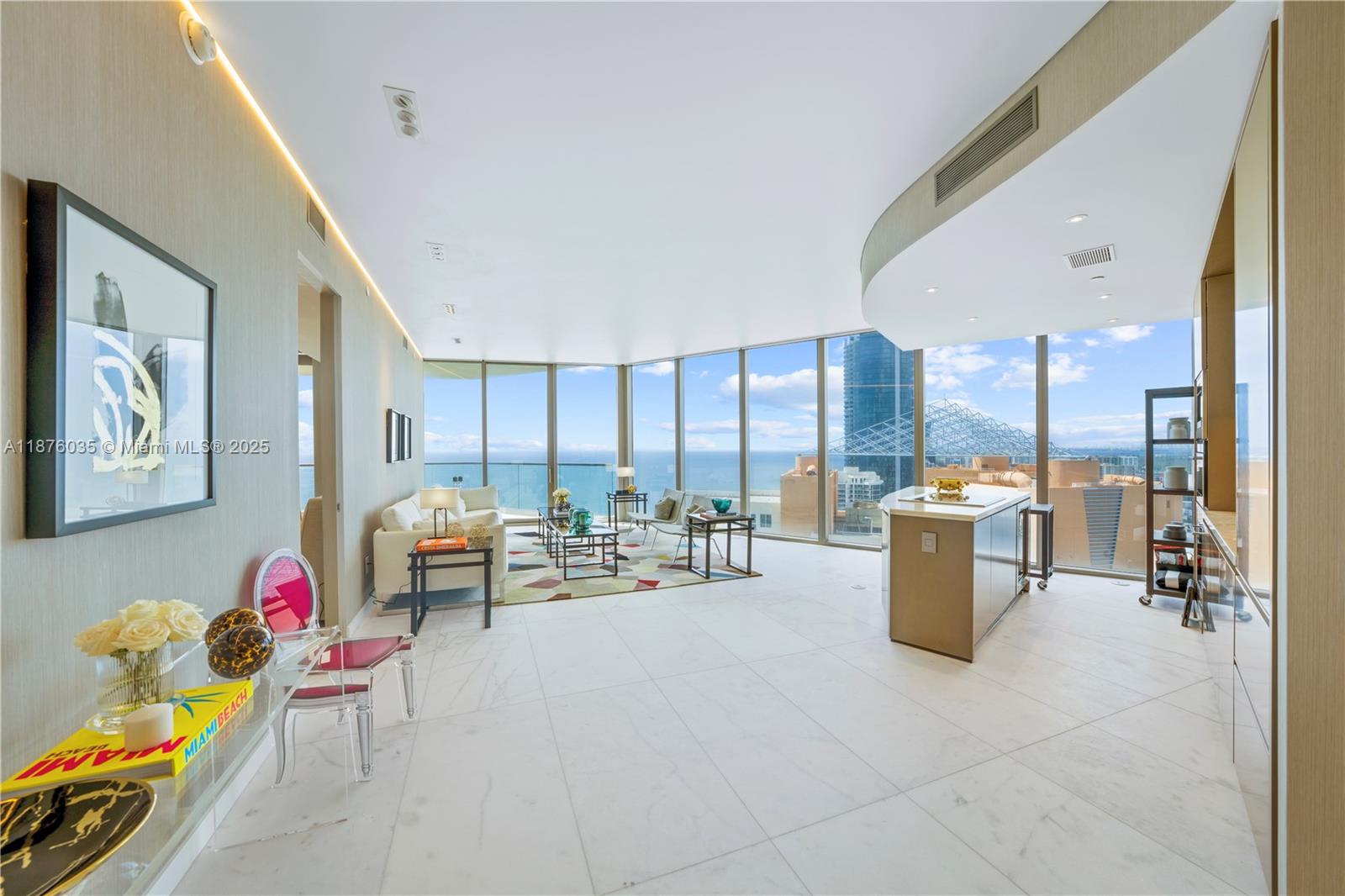 Turnkey 2 bedrooms + 2.5 bath + den corner unit with breathtaking unobstructed ocean views from every room (den is being used as a formal dining).White matte marble flooring thru-out,automatic blackout in both rooms & shades in living area;Exquisite wallpaper thru-out;Italian custom-made closets & mirrors; High-end custom designed ceiling lights;European furniture custom made. Modern kitchen & baths with European style cabinetry, stone countertops with island & top of the line appliances:Wolf ovens & espresso maker,Subzero Refrigerator & wine cooler. Large terraces with a summer kitchen. Exclusive amenities including: Restaurant, Oceanfront resort pool + bar, State-of-the-art fitness center & Spa, children’s play area,direct beach access with beach service, movie theater.
