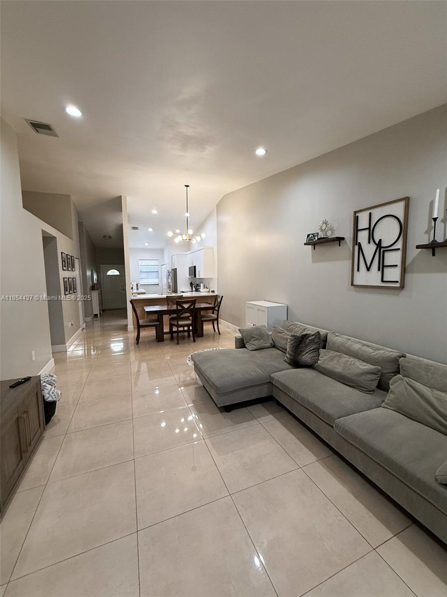 Introducing this beautifully updated townhouse, which boasts a spacious layout with 2 bedrooms and 2 full bathrooms. The modern kitchen features stainless steel appliances and elegant granite countertops, catering to both style and functionality. Ample closet space throughout the home enhances convenience. Step outside to discover a fully tiled, private patio, ideal for relaxation or entertaining guests that adds a touch of nature. Nestled in a tranquil, family-oriented neighborhood, this property is conveniently located just across the street from community amenities and is in close proximity to shopping centers, supermarkets, banks, restaurants, schools, and parks. This townhouse perfectly balances comfort, convenience, and a sense of community living. A small pet is permitted.