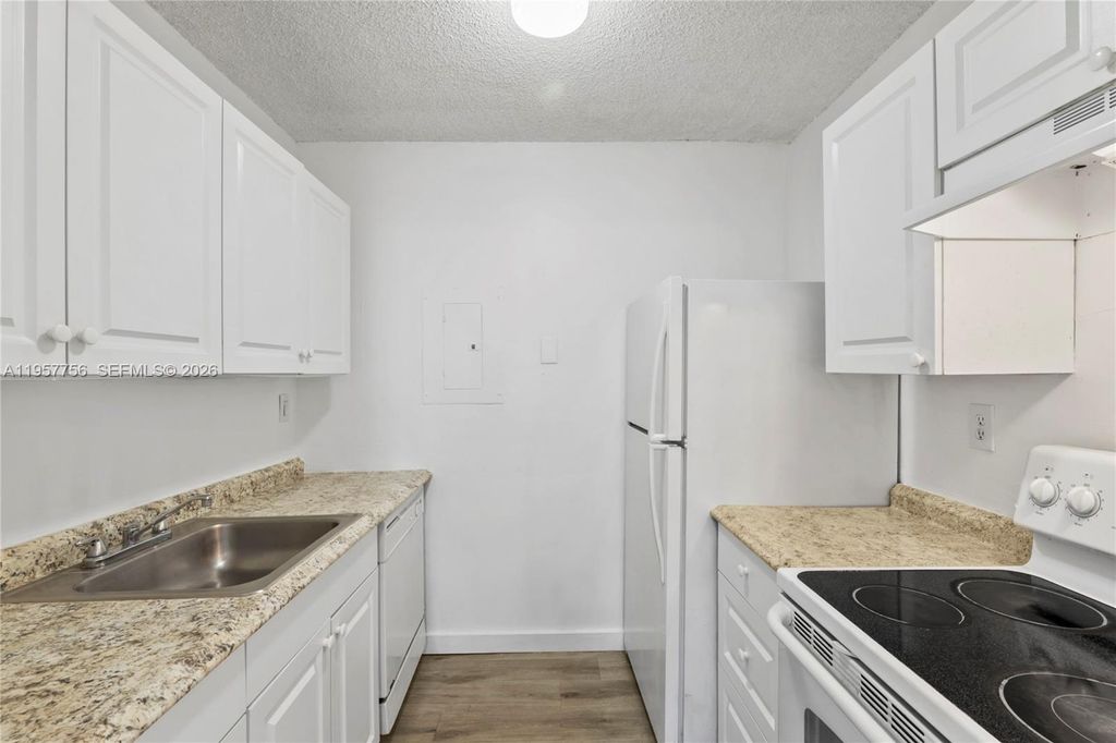 Photo of 1133 N Benoist Farms Rd #101, West Palm Beach, FL 33411 (MLS # A11957756)