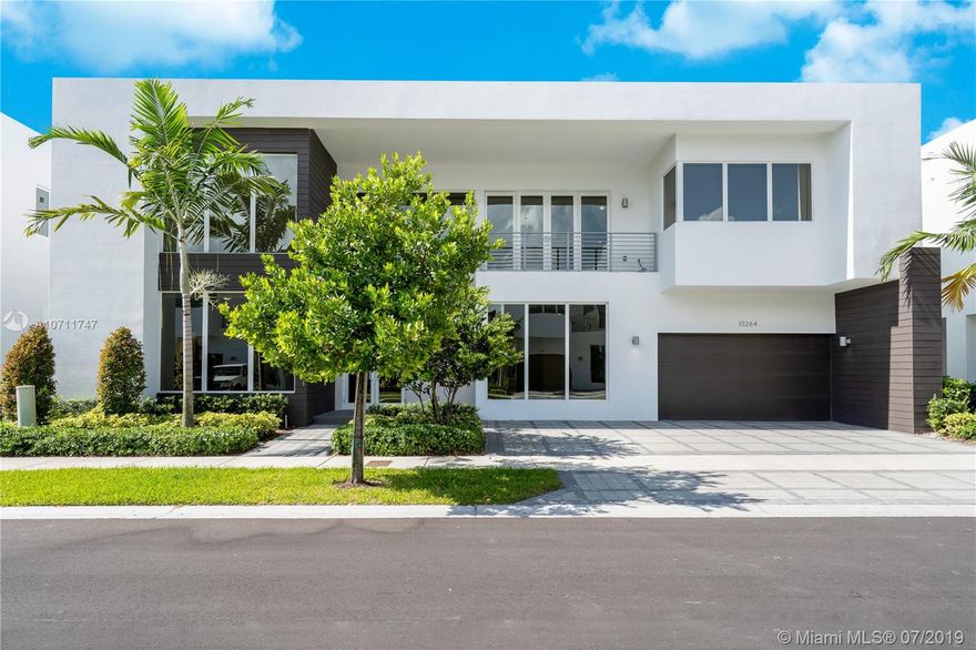 This luxurious, light-filled & spacious two-story home feat. over $185,000 in upgrades, the best location on the lake in guard gated, Modern 75 Doral with a South exposure, 24 Ft. ceilings, top of the line Italian kitchen with quartz countertops & Viking SS appliances, wine cooler, impact windows & doors, two car garage with storage cabinets & finished floors, large backyard with a heated pool & a gas summer kitchen. New Construction finished in 2017, everything in the house is new, offering you the confidence & peace of mind only a brand-new home can provide! Exclusive clubhouse which serves as an extension of your home with a fully equipped & modern fitness center, children's playroom, sauna, business center with media room & kitchenette, spa & more.