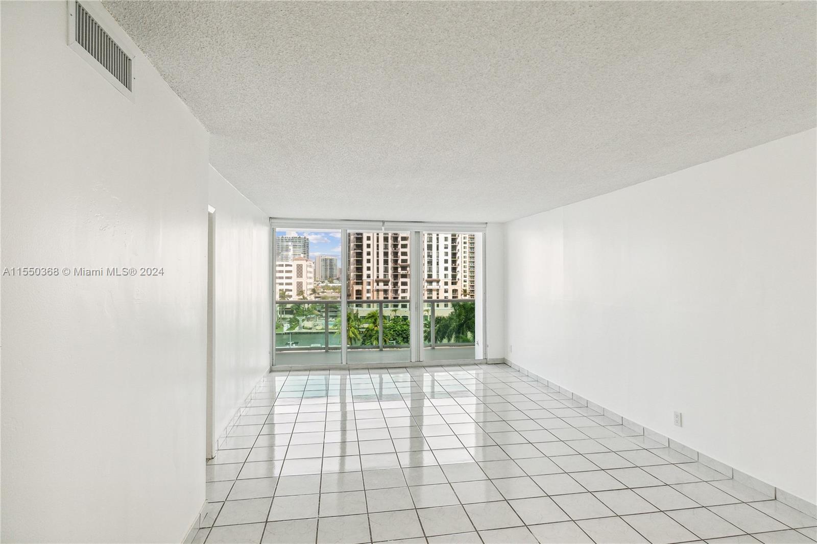 Experience breathtaking views of Sunny Isles and the serene canal from your balcony. This 2-bed, 2-bath condo provides ample space for you to personalize. It features a spacious master bathroom with double sinks, large closets including a huge walk-in, and covered parking. Nestled in a secure gated community within walking distance to the beach, this full-service building offers fantastic amenities such as a restaurant, tennis courts, pool, and gym. Don't miss out on this incredible opportunity to enjoy luxury living! It includes 1 parking space assigned covered and 1 storage cage Also available for rent at $3,300 - MLS #A11476257