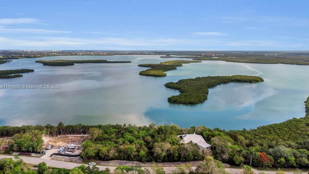Experience 0.71 acres of vacant land on Captain John T. Horr’s Island in the exclusive, gated Key Marco community. With 286 feet of frontage on Blue Hill Creek Drive, this private parcel includes a permanent boat slip at the onsite marina with direct, no-bridge access to the Gulf. The property is equipped with underground utilities, including water, sewer, electric, and internet. Key Marco’s 134 home sites enjoy a world-class fitness center, clubhouse with catering kitchen and event spaces, and private tennis courts—all just seven minutes from Marco Island’s beaches and 20 miles from Naples.
