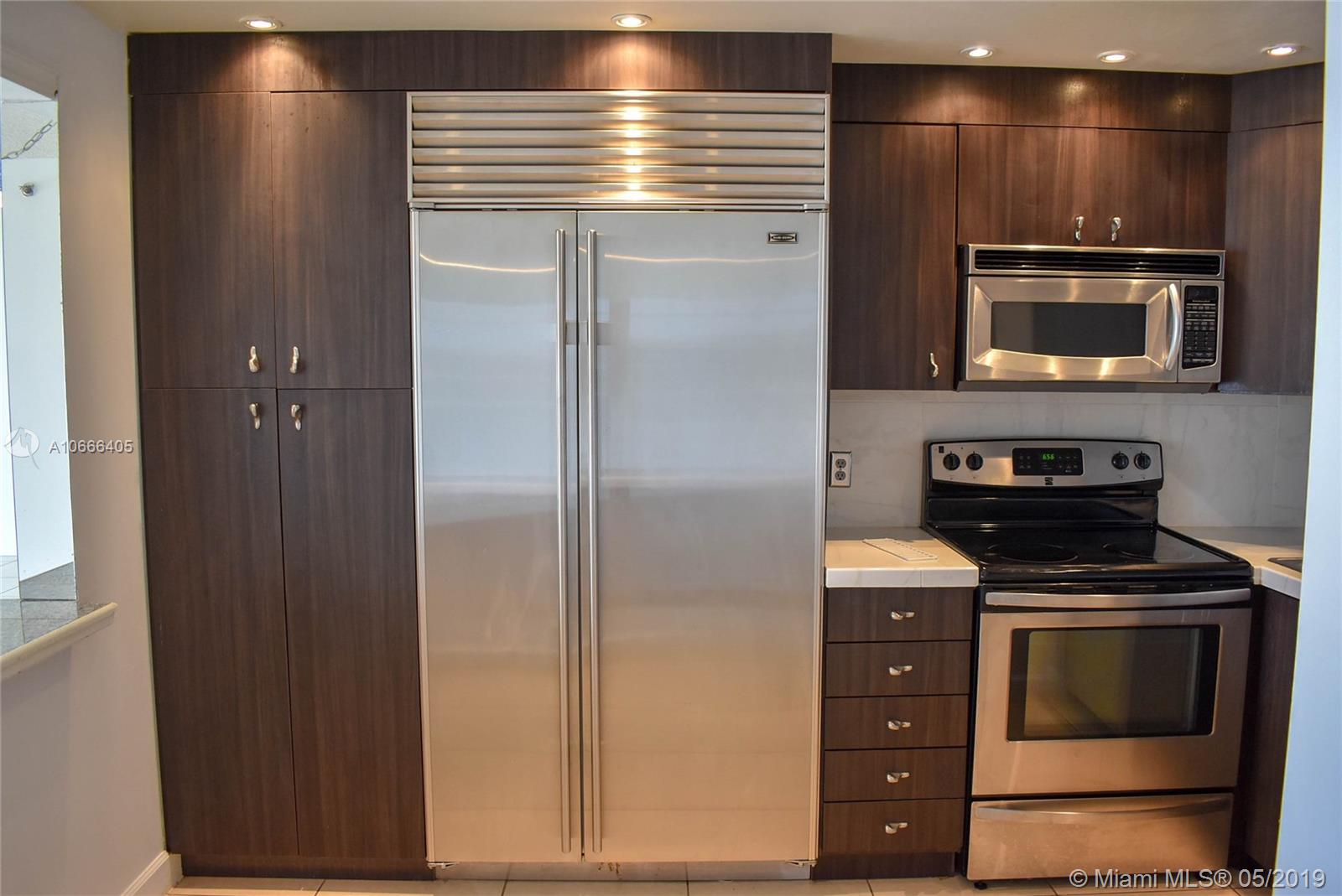 Stunning Remodeled Condo in the heart of Davie overlooking the Grand Oaks Golf Course and within walking distance to Nova Southeastern University college campus. Remodeled Kitchen with Stainless Steel Appliances AND a SUB ZERO Refrigerator. Remodeled Bathrooms, Tile Flooring Throughout, Updated Lighting in kitchen and stunning views from your large patio overlooking the skyline . Nicest Condo in the area and this will sell fast. Easy To Show.