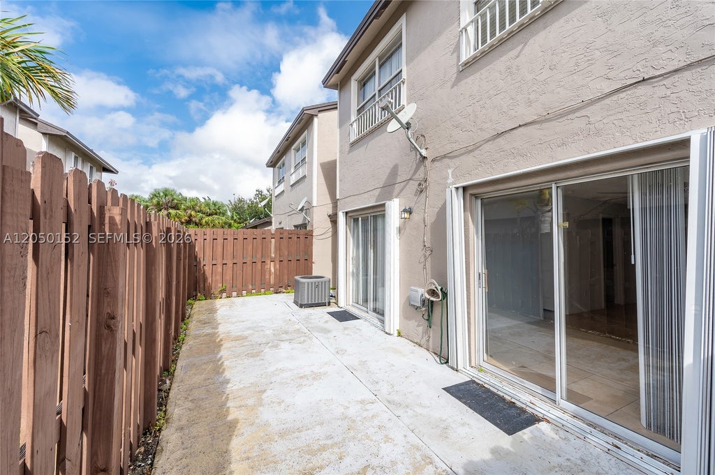 Photo of 3877 NW 122nd Ter #1-L, Sunrise, FL 33323 (MLS # A12050152)