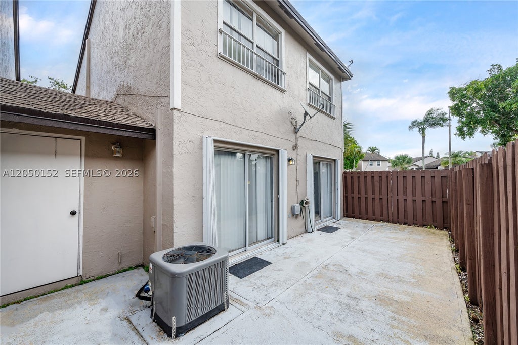 Photo of 3877 NW 122nd Ter #1-L, Sunrise, FL 33323 (MLS # A12050152)