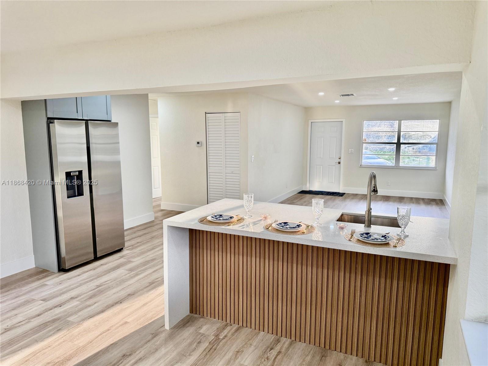 Just Renovated! Beautiful 4-bedroom, 2-bath home offering 1,382 sq ft under A/C. One bedroom is perfect for guests or in-laws, providing privacy and comfort. Enjoy a modern kitchen with granite countertops, waterproof vinyl floors, plus a brand-new roof & A/C. NO HOA. Prime location—only 15 minutes from Fort Lauderdale Beach and close to I-95 and the Turnpike. Large backyard with plenty of space for an RV or large trailer. Located just one block from the City of Lauderhill’s LPAC project, adding great value and future appreciation potential.
