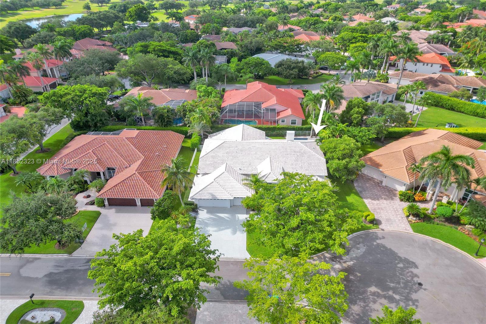 WOW! GREAT VALUE ON THIS LIGHT & BRIGHT CONTEMPORARY HOME WITH APRX 3,900 SQ. FT. LIVING AREA AND A WATERFALL SPA/POOL ON A QUIET PRIME CUL-DE-SAC LOT IN THE POPULAR GREENS SECTION OF GUARD GATED EAGLE TRACE! ENORMOUS ISLAND KITCHEN! SPACIOUS PRIMARY SUITE! POPULAR SPLIT BEDROOM FLOOR PLAN WITH 5 TRUE BEDROOMS, 4 FULL BATHS AND A 3-CAR GARAGE! B24" DIAGONAL TILE THROUGHOUT LIVING AREAS AND WIDE PLANK LAMINATE FLOORING IN BEDROOMS! ROOF REPLACED 2006! BATHS HAVE DESIGNER TILE! GREAT FOR ENTERTAINING WITH A LARGE SCREENED PORCH WITH A SUMMER KITCHEN!