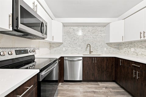 Photo of 16325 Golf Club Rd #104, Weston, FL 33326 (MLS # A12079304)