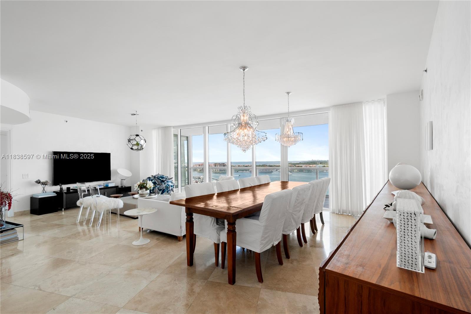 This rare 01 line 3-bed, 3.5-bath unit boasts an 800 Sq Ft wraparound terrace with sweeping views of Biscayne Bay, surrounding islands, cruise ships, and iconic Miami sunsets. A tastefully partially furnished, residence at Icon South Beach—Philippe Starck’s flagship project in the exclusive South of Fifth district. Enjoy luxury amenities including a full-service spa, cutting-edge fitness center, two pools, concierge, and 24-hour valet. Just steps from Miami’s top restaurants, South Pointe mega yacht marina, and one of the city’s most beautiful parks.
Some furniture is included, excluding art, personal items, linens, towels, kitchenware, and selected chandeliers. Inventory list to be provided. Video-Virtual Tour in the MLX.