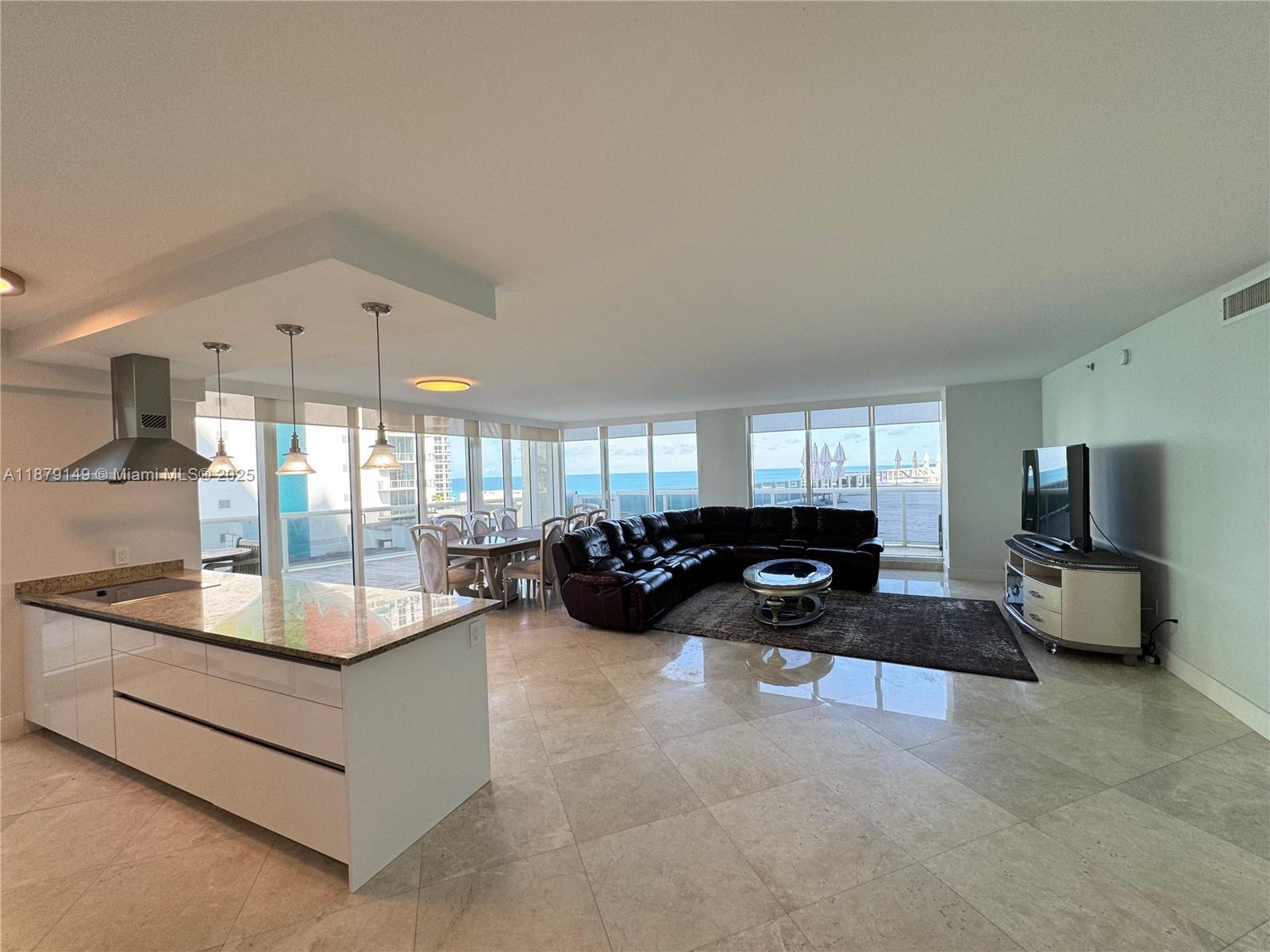 Experience luxury living in this fully furnished 3-bedroom, 3.5-bath corner residence, boasting 2,078 sq. ft. of air-conditioned space. Recently updated with a sleek new kitchen, custom closets, and elegant marble floors, this home offers a modern touch with timeless appeal. The oversized wrap-around terrace provides direct access to the pool area and whirlpools, perfect for enjoying outdoor living. Located within the prestigious Beach Club, residents enjoy 5-star resort-style amenities, including a stunning 3-story lobby with a full-time concierge, 24-hour security, and valet services. Relax in one of five heated oversized pools or rejuvenate in the 28,000 sq. ft. ocean-view spa and fitness center. This is coastal living at its finest.